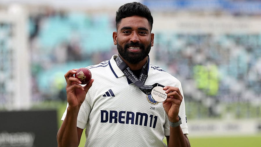 <div class="paragraphs"><p> India's Mohammed Siraj poses after winning the player of the match award after India won the match to draw the test series</p></div>