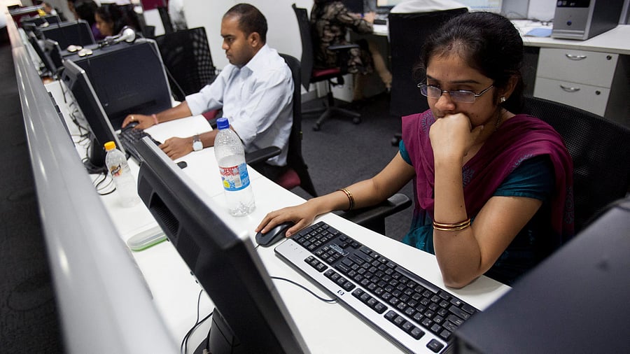 <div class="paragraphs"><p>FILE PHOTO: Workers are seen at their workstations on the floor of an outsourcing centre in Bangalore, February 29, 2012.</p></div>