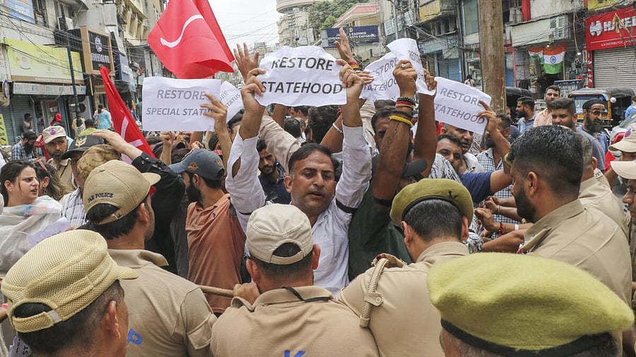 <div class="paragraphs"><p>Policemen attempt to National Conference workers during a protest march demanding restoration of statehood to Jammu and Kashmir.&nbsp;</p></div>