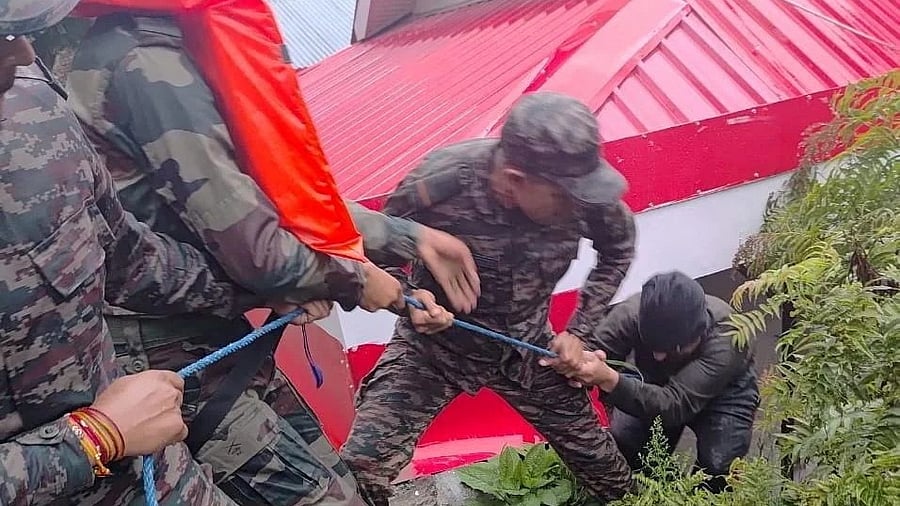 <div class="paragraphs"><p>File photo: Rescuers assist a man, amid flash floods, in Dharali, Uttarakhand, India, August 5, 2025 in this handout image. </p></div>