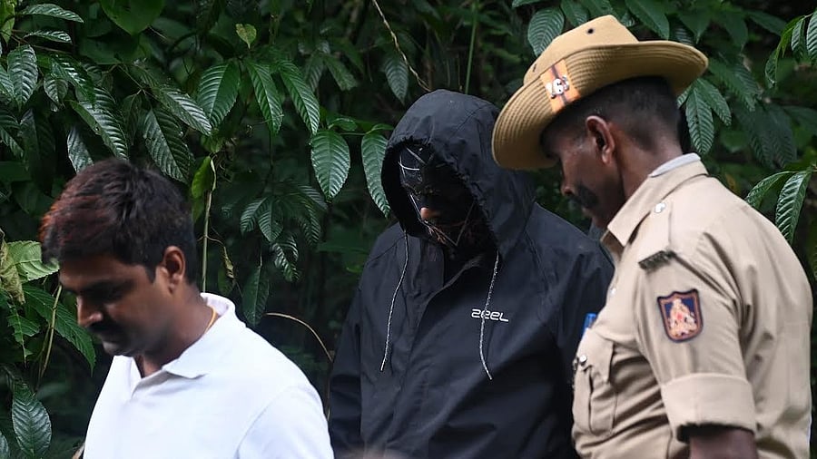 <div class="paragraphs"><p>Complainant-witness coming out of the forest area after carrying out searches with the SIT team, near the Nethravathi river in Dharmasthala police station limits on Wednesday.</p></div>