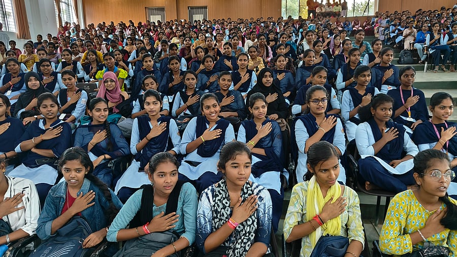 <div class="paragraphs"><p>Female students take a pledge that they will study daily and will not engage in love affairs, during an&nbsp;interaction programme with State Women’s Commission Chairperson Nagalakshmi Chowdhary at the G H College auditorium in Haveri on Tuesday. </p></div>