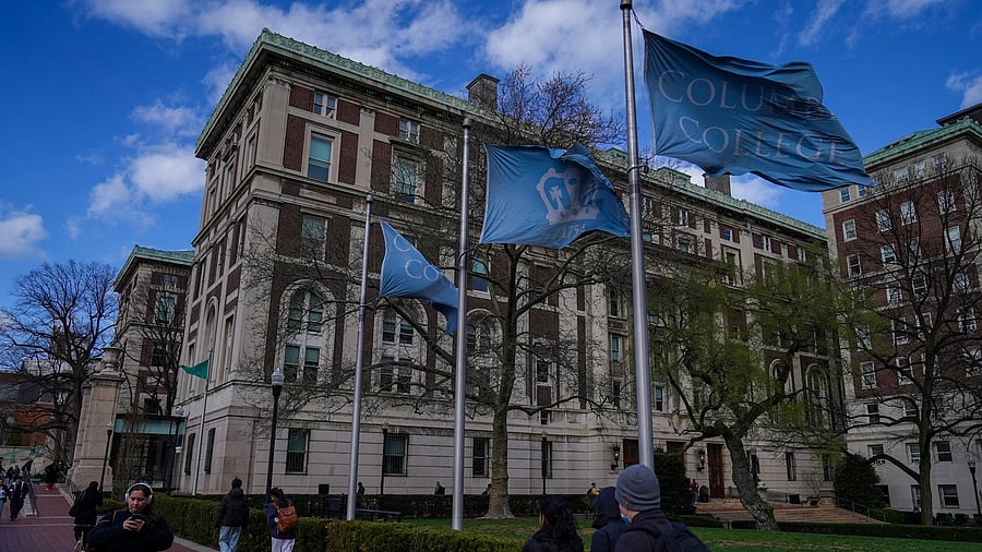 <div class="paragraphs"><p>FILE PHOTO: People walk on campus at Columbia University in New York City. </p></div>