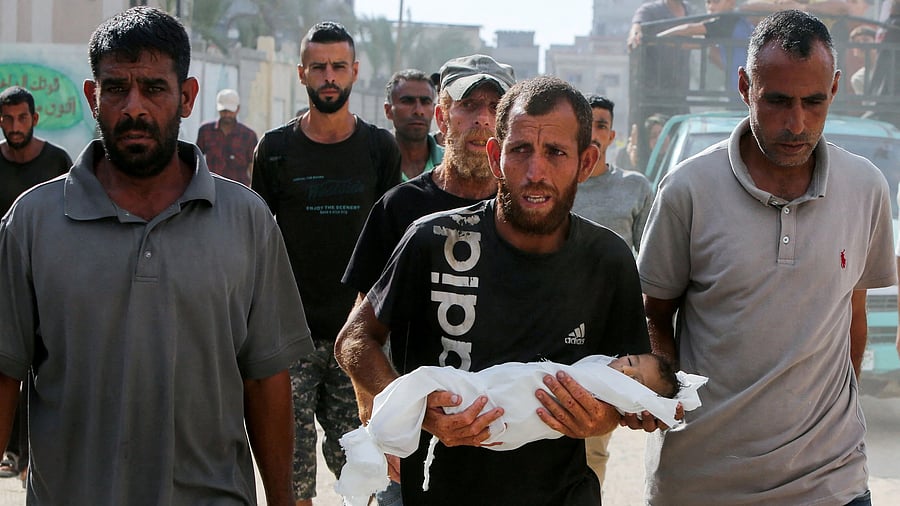 <div class="paragraphs"><p> Palestinian father Fadi Al-Najjar mourns his three-month-old baby Yehia, who died due to malnutrition amid a hunger crisis, according to medics, outside Nasser Hospital in Khan Younis, in the southern Gaza Strip July 20, 2025. REUTERS/Hatem Khaled</p></div>