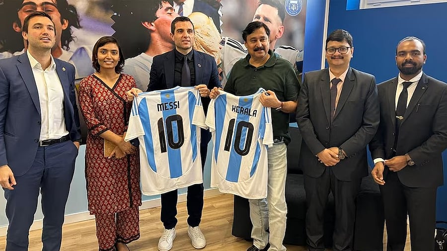 <div class="paragraphs"><p>In this file image, Kerala Sports Minister V Abdurahiman poses with other officials during his visit to Madrid.</p></div>