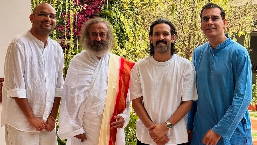 <div class="paragraphs"><p>Vikrant Massey and Sri Sri Ravishankar with <em>White</em> makers.</p></div>