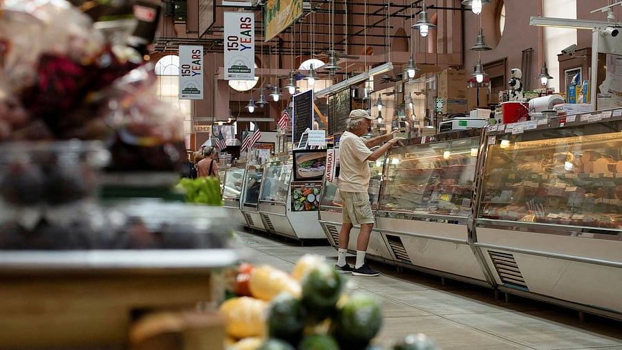 <div class="paragraphs"><p>A man shops for meat at Eastern Market in Washington</p></div>