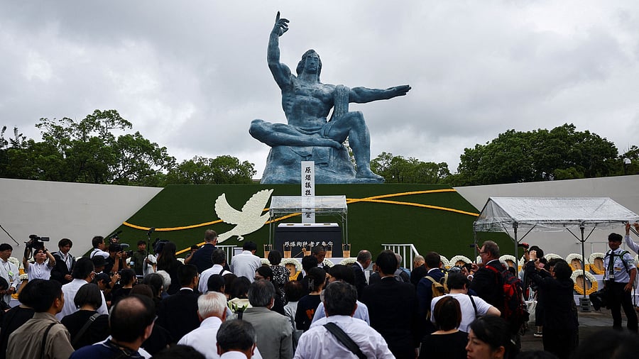 <div class="paragraphs"><p>Attendees pray for the victims in front of the Nagasaki Peace Statue on the day of a ceremony commemorating the 80th anniversary of the bombing of the city, at Nagasaki's Peace Park in Nagasaki, southwestern Japan, August 9, 2025.</p></div>
