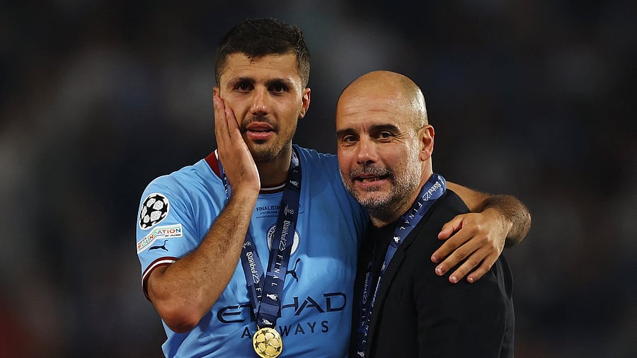 <div class="paragraphs"><p>Manchester City manager Pep Guardiola (R) and Ballon d'Or winner Rodri (L).</p></div>