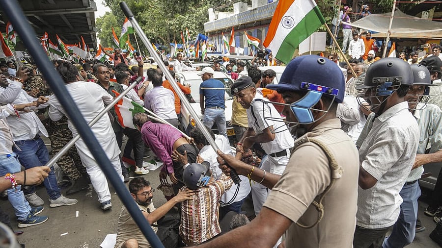 <div class="paragraphs"><p>BJP members and security personnel clash during a protest organised to mark the completion of one year of the rape and murder of a trainee doctor at RG Kar hospital, in Kolkata, West Bengal, Saturday, Aug. 9, 2025.</p></div>
