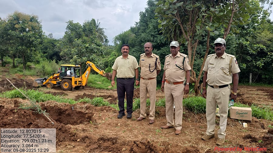 Assistant Conservator of Forest Ganesh R and other personnel from the Bengaluru Urban division during the anti-encroachment drive. 
