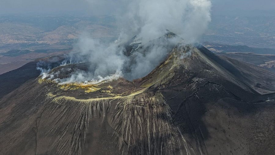 <div class="paragraphs"><p>A drone picture shows smoke and ash rising from a crater during an eruption of Mount Etna, on the island of Sicily, Italy.</p></div>