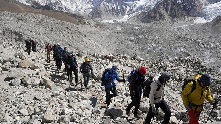 <div class="paragraphs"><p>File photo: Mountaineers and trekkers head towards the Everest base camp in Nepal.</p></div>