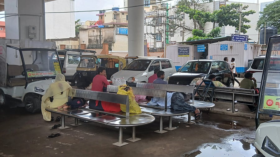 <div class="paragraphs"><p>Train passengers wait anxiously at the Yeshwantpur railway station on Sunday.</p></div>