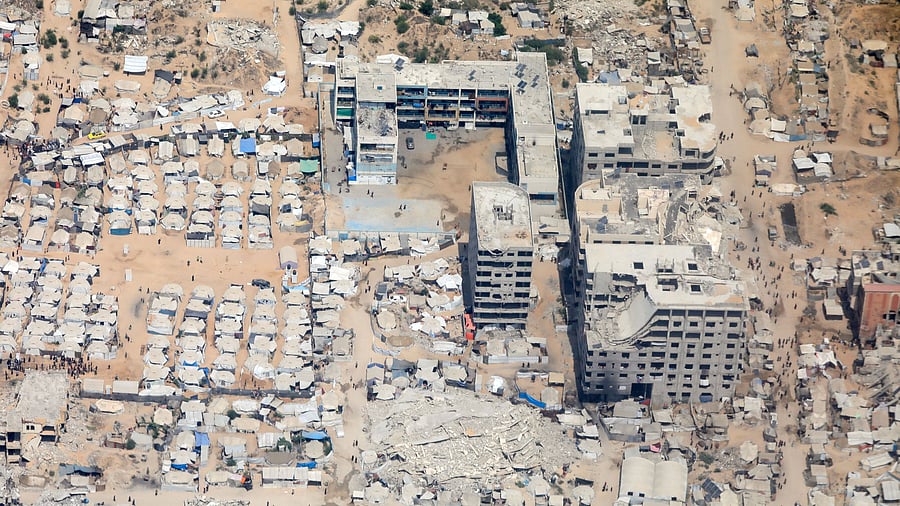<div class="paragraphs"><p>An aerial view from a Jordanian military aircraft shows the Gaza Strip, before humanitarian aid is airdropped over it, in Gaza, August 9, 2025.</p></div>