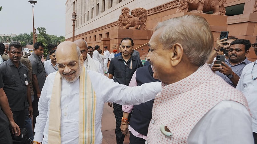 <div class="paragraphs"><p>Union Home Minister Amit Shah, left, and Congress MP Pramod Tiwari during the Monsoon session of Parliament, in New Delhi</p></div>