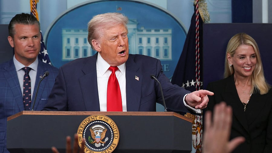 <div class="paragraphs"><p>US President Donald Trump speaks next to US Defense Secretary Pete Hegseth and US Attorney General Pam Bondi during a press conference.</p></div>