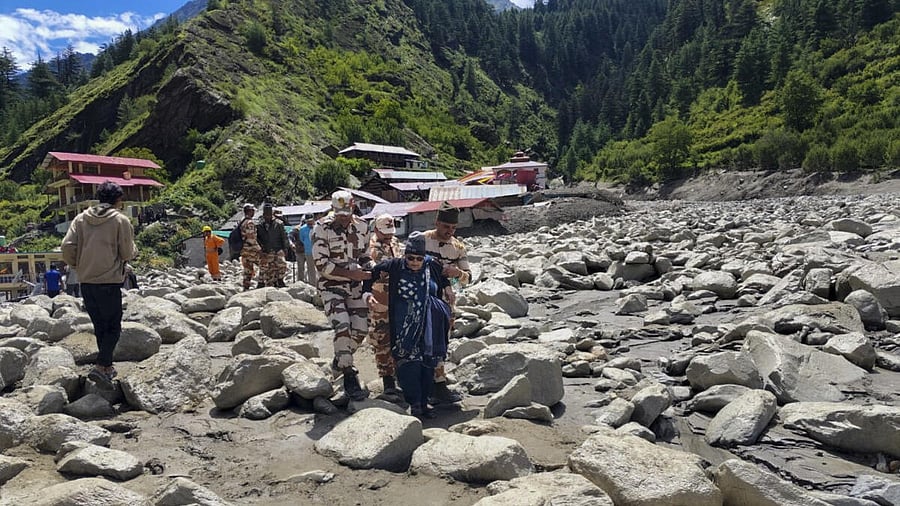 <div class="paragraphs"><p>Stranded people being rescued following flash floods triggered by a cloudburst at Dharali region, in Uttarkashi district of Uttarakhand, Thursday, Aug. 7, 2025.</p></div>