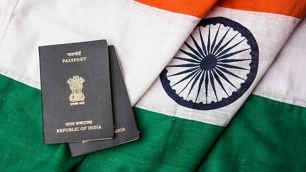 <div class="paragraphs"><p>A representative image showing an Indian passport against the backdrop of national flag.</p></div>