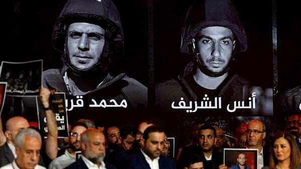 <div class="paragraphs"><p>Al Jazeera staff members gather at the network’s studios to remember their colleagues killed in Gaza City by an Israeli strike, in Doha.</p></div>