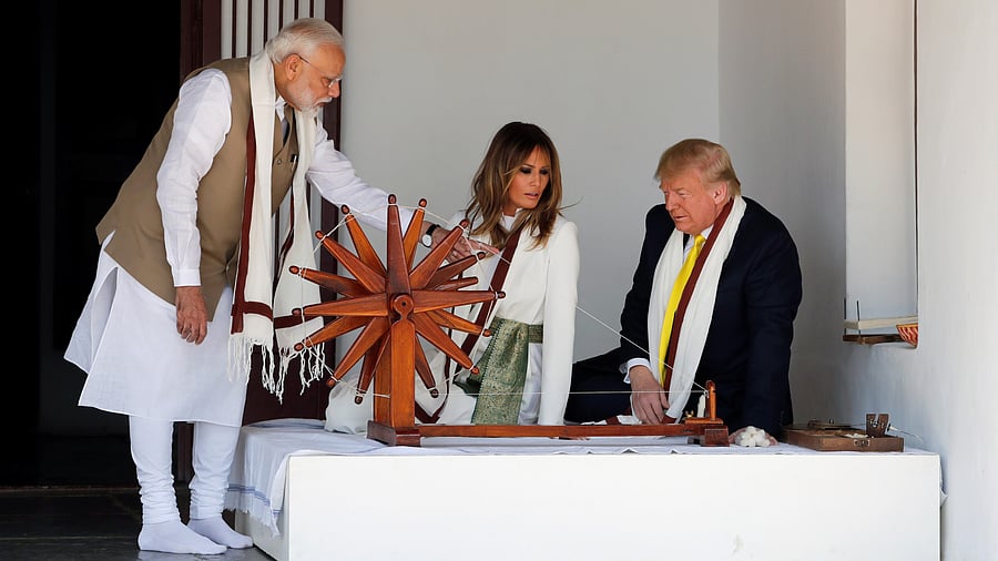 <div class="paragraphs"><p>US President Donald Trump and first lady Melania Trump look at Charkha, a type of Indian spinning wheel, next to Prime Minister Narendra Modi, as they visit the Gandhi Ashram in Ahmedabad, India February 24, 2020. For representational purposes.</p></div>