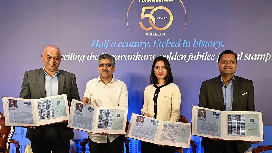 <div class="paragraphs"><p>Purvankara leadership with Chief Postmaster General, Karnataka Postal Circle, K Prakash (second from left) release&nbsp;a special stamp to commemorate 50-years of the&nbsp;realty firm, in Bengaluru on Wednesday. </p></div>