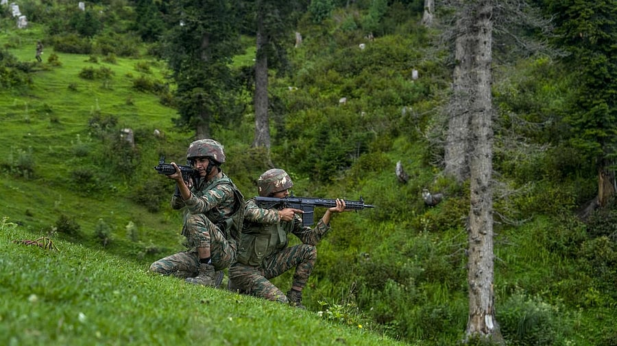 <div class="paragraphs"><p>Indian Army jawans keep watch near the Line of Control (LoC), ahead of Independence Day, in Uri sector of Baramulla district, north Kashmir.</p></div>