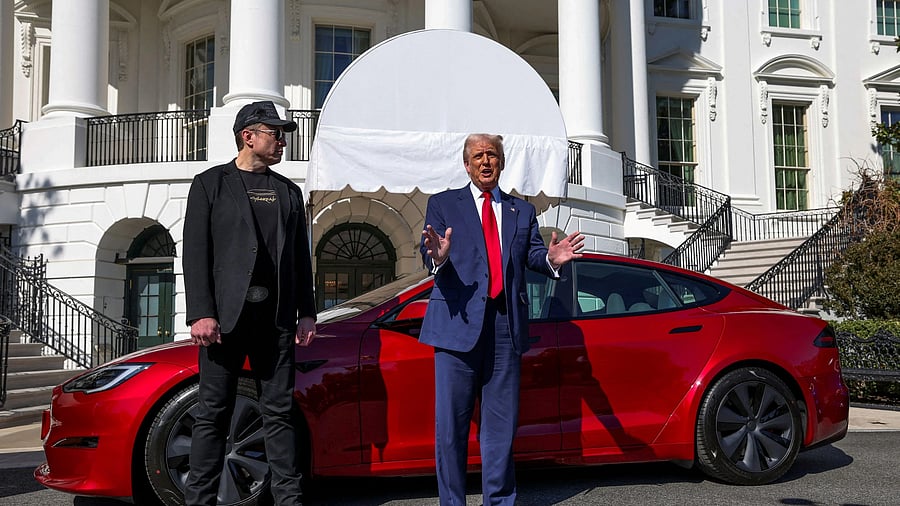 <div class="paragraphs"><p>US President Donald Trump talks to the media next to Tesla CEO Elon Musk, </p></div>