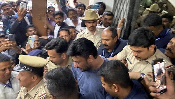 <div class="paragraphs"><p>A file image of actor Darshan being taken to a Bengaluru court in connection with Renukaswamy murder case.&nbsp;</p></div>