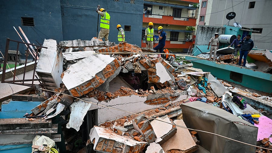 <div class="paragraphs"><p>Personnel from State Disaster Response Fund (SDRF),&nbsp;Fire and Emergency Services and other experts at the site where one person died and nine injured in a suspected LPG cylinder&nbsp;explosion at&nbsp;Chinnayanapalya near Wilson Garden in Bengaluru on Friday. </p></div>