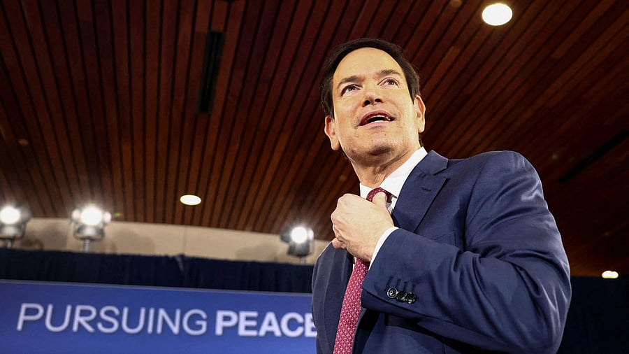 <div class="paragraphs"><p>US Secretary of State Marco Rubio reacts as he attends a press conference held by US President Donald Trump and Russian President Vladimir Putin following their meeting to negotiate an end to the war in Ukraine, at Joint Base Elmendorf-Richardson, in Anchorage, Alaska, US.</p></div>