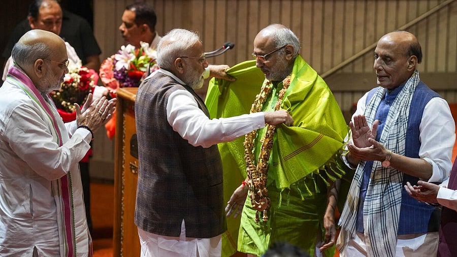 <div class="paragraphs"><p>Prime Minister Narendra Modi felicitates Maharashtra Governor and NDA's vice presidential candidate C.P. Radhakrishnan as Defence Minister Rajnath Singh and Union Home Minister Amit Shah applaud during the NDA parliamentary party meeting.</p></div>