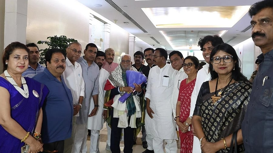 <div class="paragraphs"><p>Former SC judge B Sudershan Reddy with Opposition leaders</p></div>