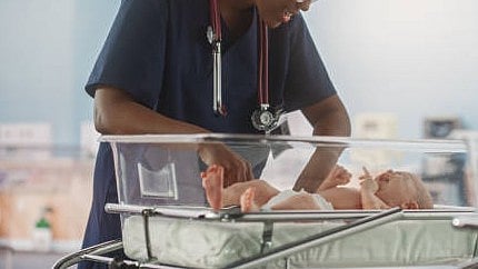 <div class="paragraphs"><p>Representative image showing a nurse with a newborn.</p></div>