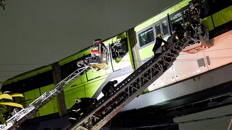<div class="paragraphs"><p>Passengers being rescued after a Monorail train came to a halt between Mysore Colony and Bhakti Park stations due to apparent power failure during rainfall, in Mumbai.</p></div>