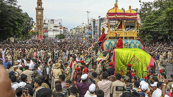 <div class="paragraphs"><p>Devotees take part in a procession of goddess Chamundeshwari during Dasara celebration, in Mysuru, 2024.</p></div>