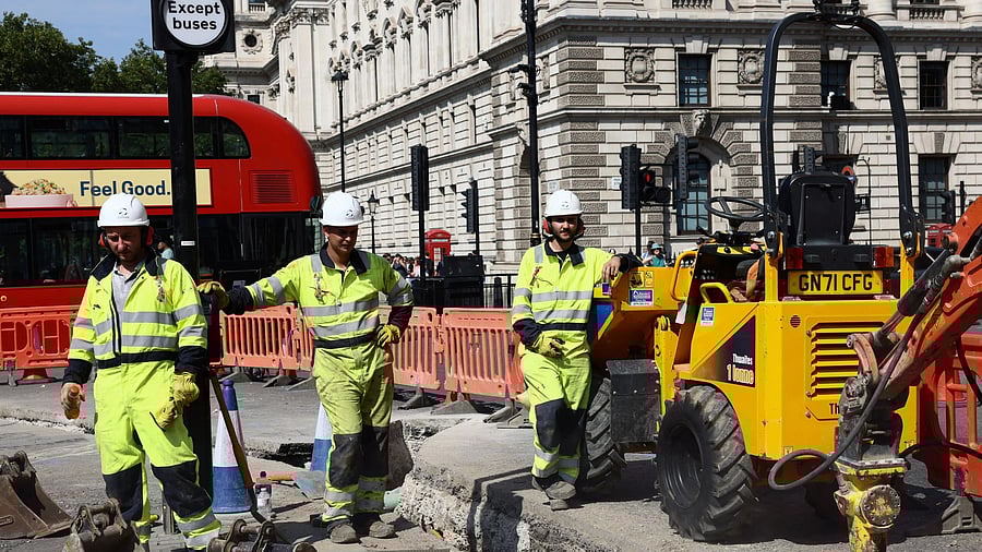 <div class="paragraphs"><p>Workmen pause as they dig up a section of road in Westminster during a heatwave, in London, Britain, August 12, 2025. </p></div>