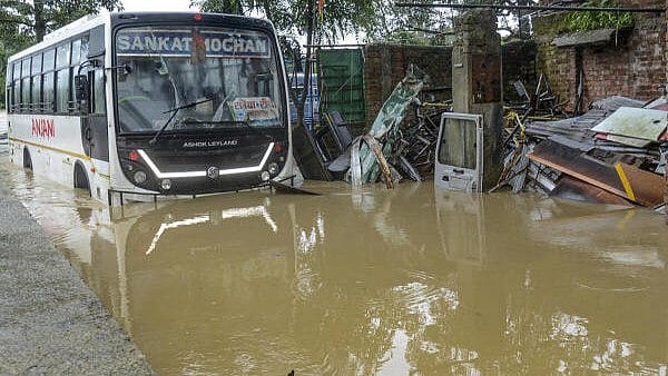 <div class="paragraphs"><p>A bus at a waterlogged garage after heavy rainfall, in Ranchi, Jharkhand.</p></div>
