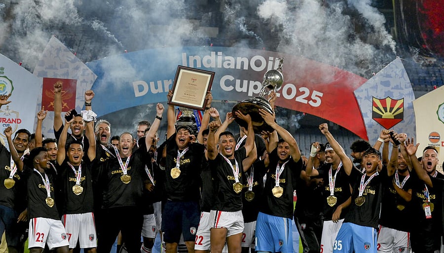 <div class="paragraphs"><p>NorthEast United FC's players celebrate with the trophy after winning the Durand Cup 2025, at Vivekananda Yuba Bharati Krirangan, in Kolkata, Saturday, Aug. 23, 2025.</p></div>