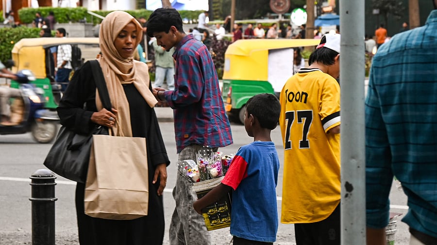 <div class="paragraphs"><p>Around 16% of children in Karnataka, Telangana, Andhra Pradesh and Tamil Nadu were found to be working.&nbsp;In pic, a child sells flowers to a woman in Bengaluru. </p></div>
