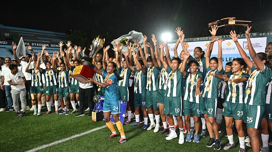 <div class="paragraphs"><p>Kickstart FC, winners of the Karnataka Women’s League, celebrate with the trophy at the Bangalore Football Stadium on Sunday. </p></div>