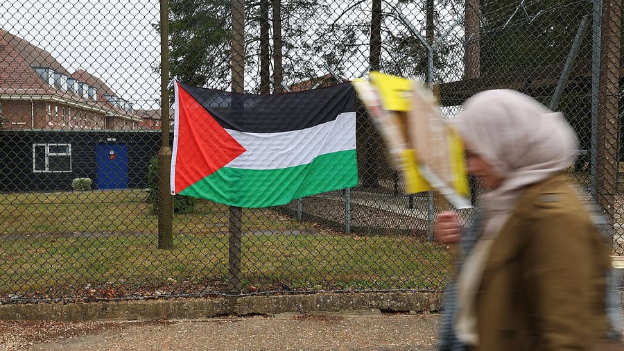 <div class="paragraphs"><p>A Palestinian flag hangs on the fence of RAF High Wycombe, while demonstrators take part in a protest from the Palestine Solidarity Campaign calling for an arms embargo on Britain's weapons exports to Israel, as part of the group's Summer of Action for Gaza, in Buckinghamshire, Britain. </p></div>