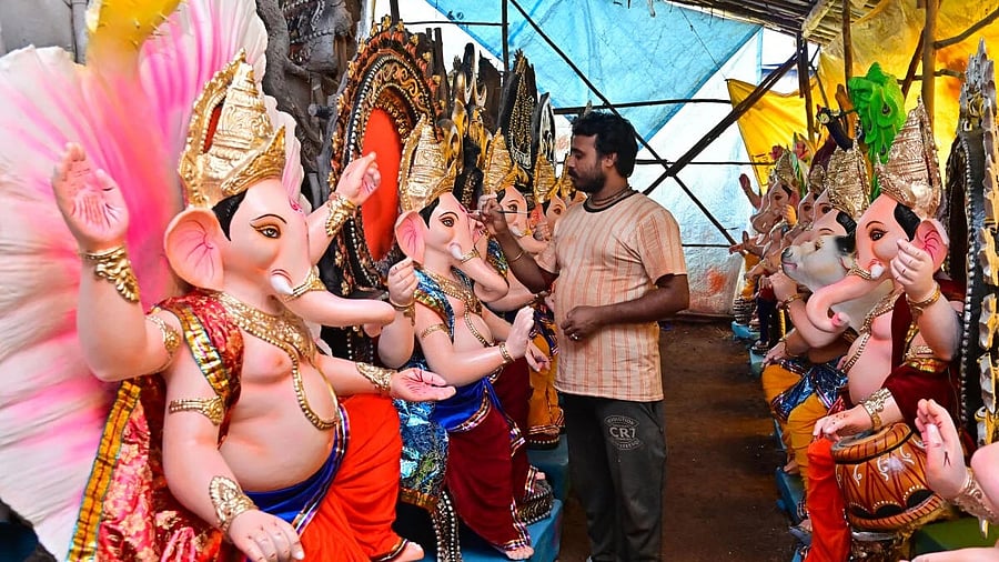 <div class="paragraphs"><p>An idol maker from West Bengal gives final touches to the idols of Lord Ganesha at a workshop on the outskirts of Davanagere. </p></div>
