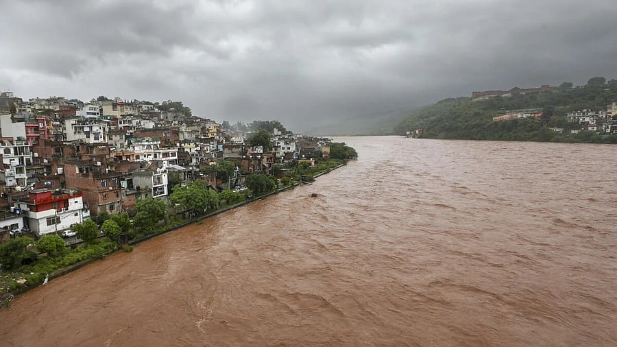 <div class="paragraphs"><p>File photo of torrential rains in Jammu leading to swollenTawi river in J&amp;K.</p></div>