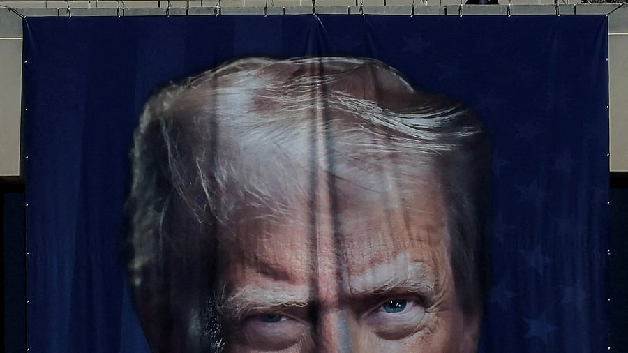 <div class="paragraphs"><p>A large banner featuring US President Donald Trump </p></div>