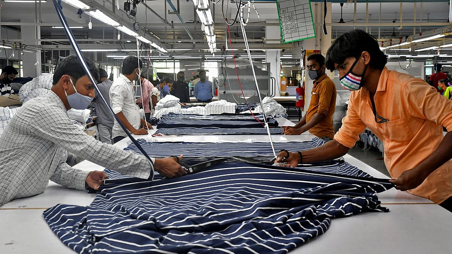 <div class="paragraphs"><p>Garment workers cut fabric to make shirts at a textile factory of Texport Industries in Hindupur town in the southern state of Andhra Pradesh</p></div>