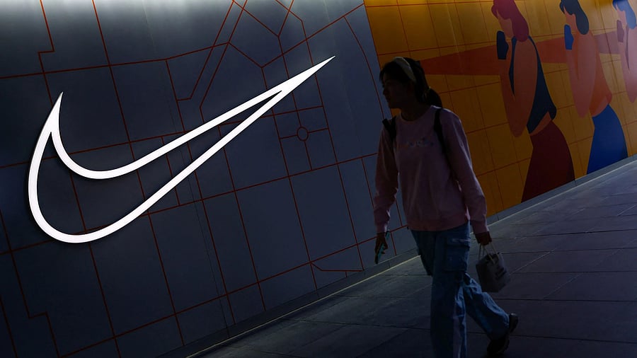 <div class="paragraphs"><p>A woman walks past a Nike store.</p></div>