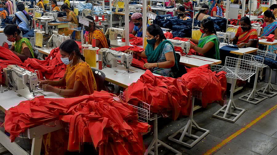<div class="paragraphs"><p>Garment workers stitch shirts at a textile factory in Hindupur town in the southern state of Andhra Pradesh.</p></div>