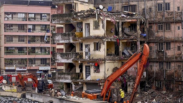 <div class="paragraphs"><p>Rescue operation underway after a four-storey unauthorised building collapsed onto adjacent vacant chawl, at Virar, in Palghar district.</p></div>