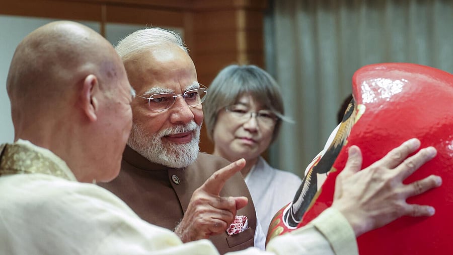 <div class="paragraphs"><p>Prime Minister Narendra Modi being presented a Daruma Doll by Chief Priest of Shorinzan Daruma Temple,</p></div>
